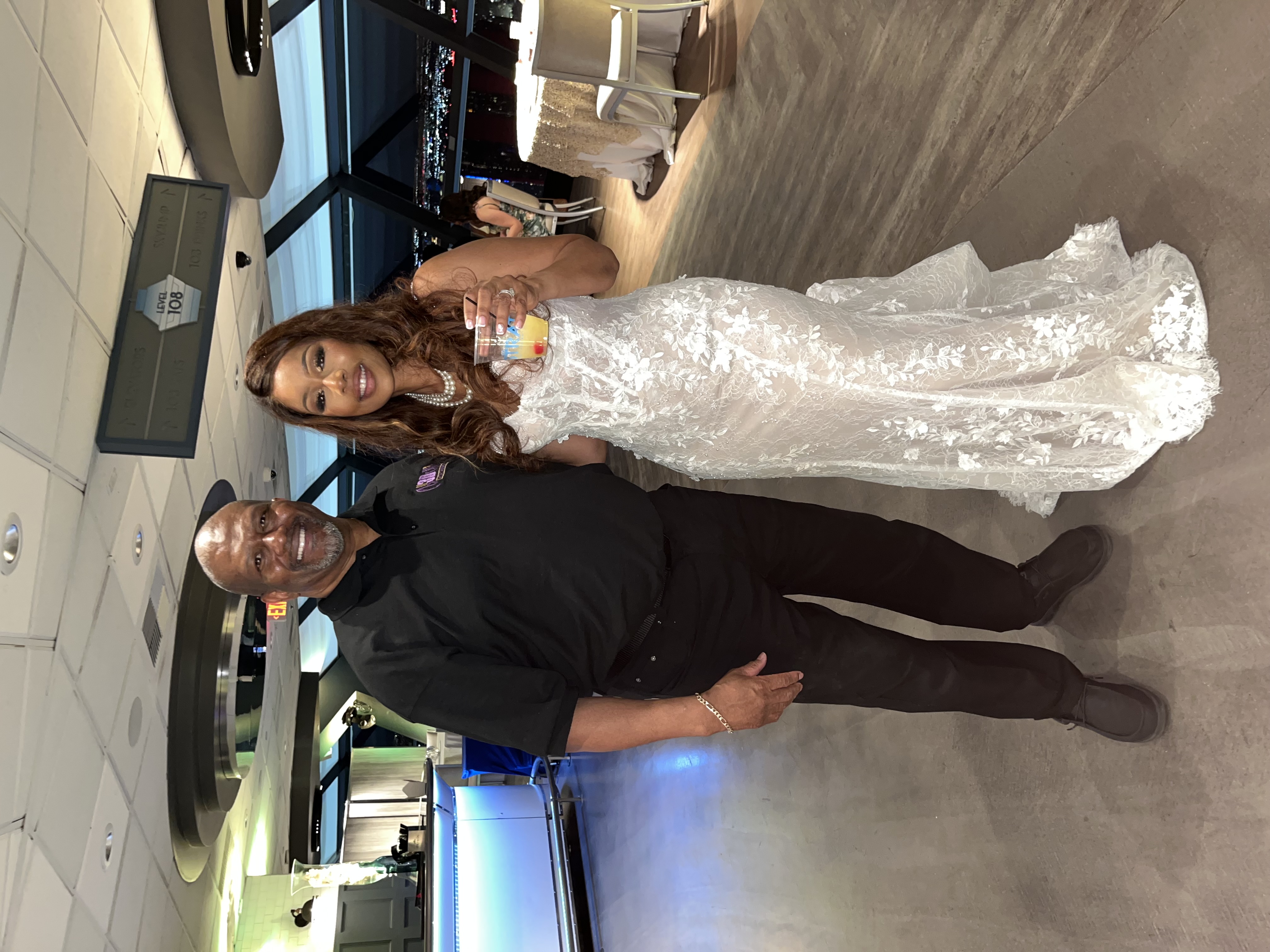 DJ with bride at wedding reception